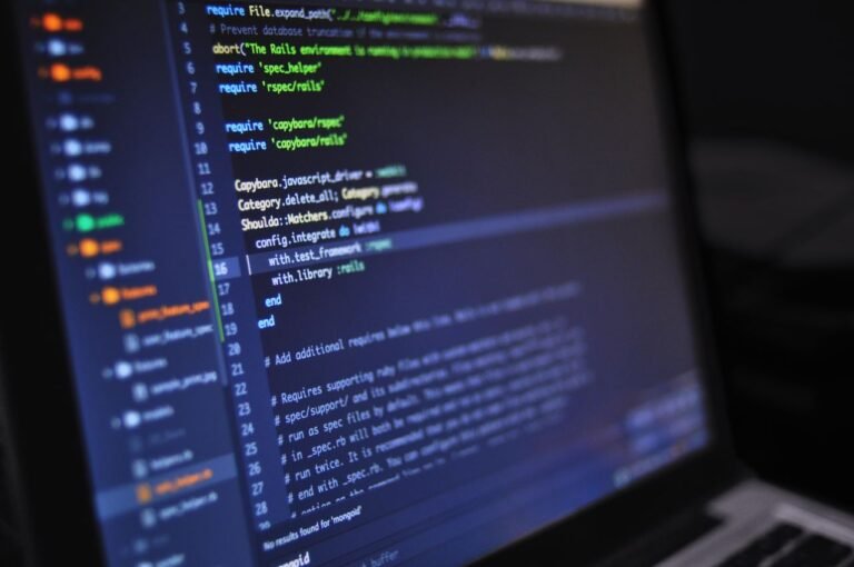 Jasa Pembuatan Website UMKM di BSD yang SEO Friendly Close-up of a computer screen displaying programming code in a dark environment.